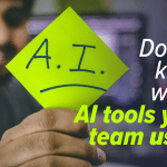 A smiling man holding up a bright yellow sticky note marked "A.I." with a downturned mouth drawn underneath, next to the headline "Do you know which AI tools your team uses?" and the EC Computers logo.